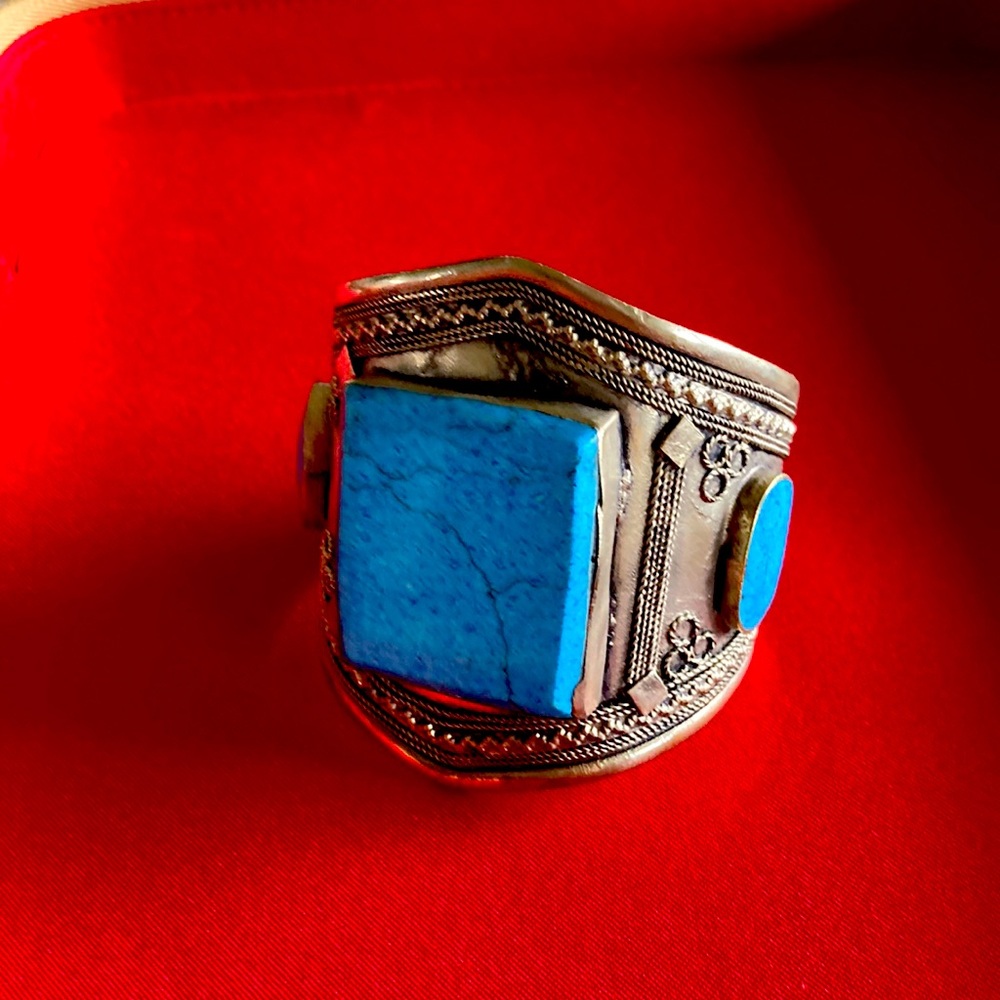 Beautiful silver metal with large turquoise stones mined in Afghanistan.